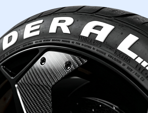 White painted tire lettering on a black tire
