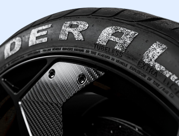 Before: worn white tire lettering